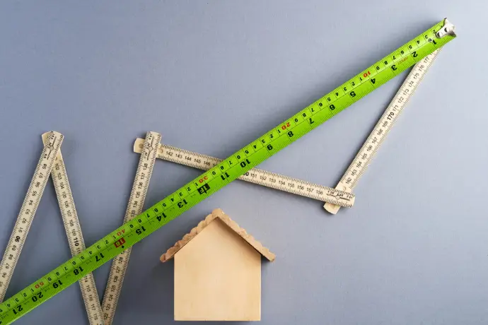 green ruler on white surface